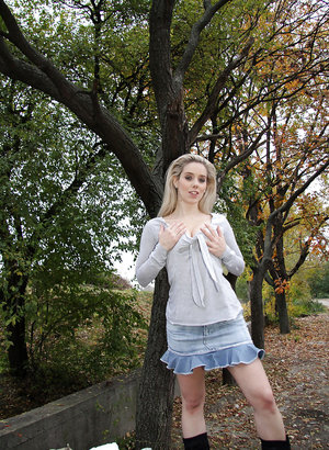 18 year old girl Agnes uncovers her perky tits as she gets completely naked